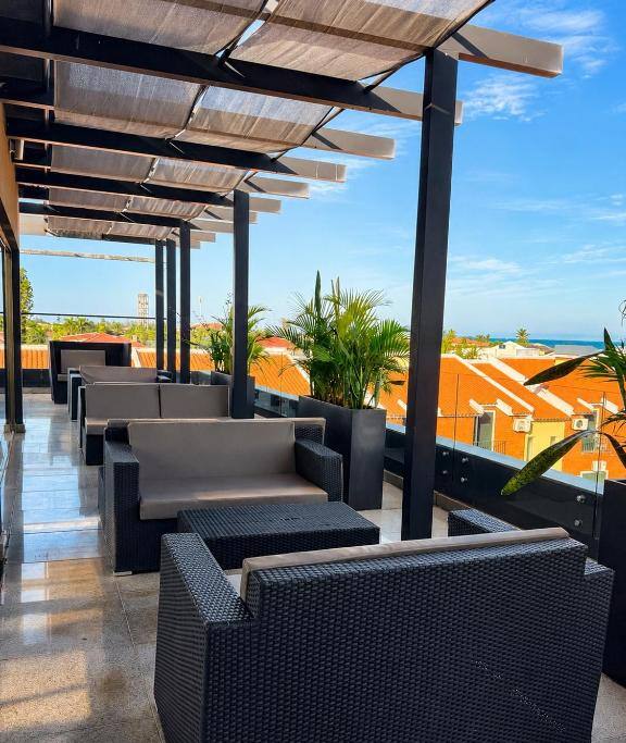 Shaded rooftop terrace with sea views